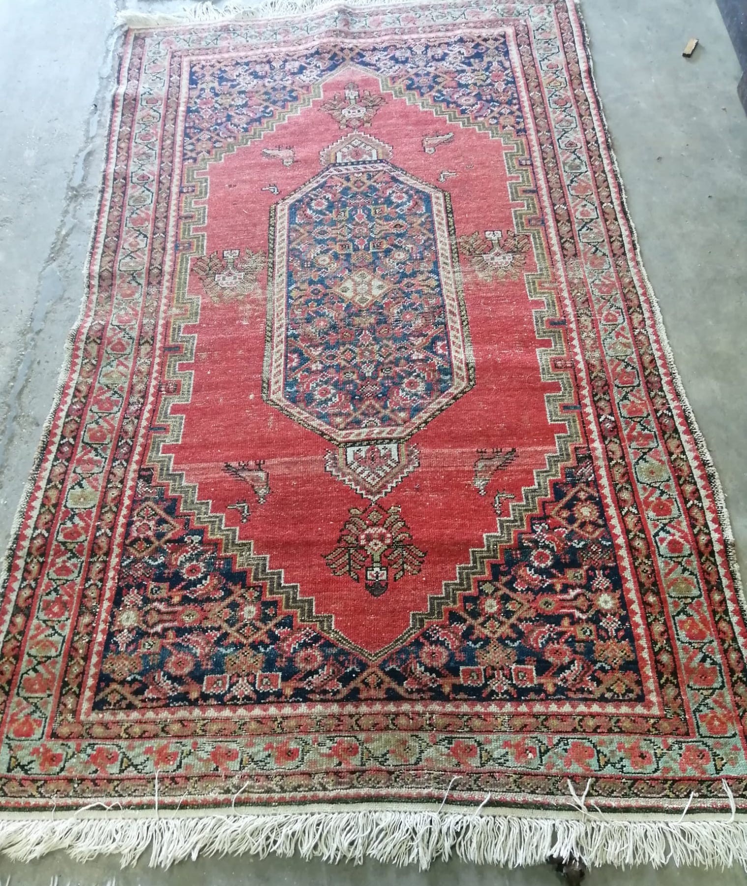 Two antique North West Persian red ground rugs, (worn) larger 183 x 125cm *Please note the sale commences at 9am.